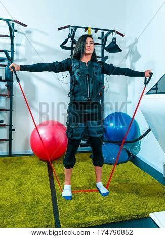 The female athlete doing they exercise in the EMS fitness studio