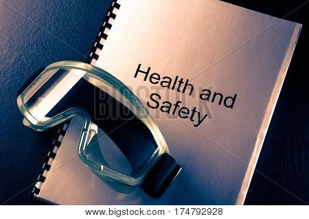 Health And Safety Document With Goggles