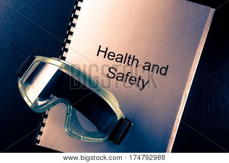 Health And Safety Document With Goggles