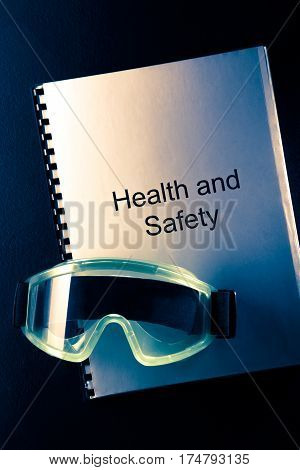 Health And Safety Document With Goggles