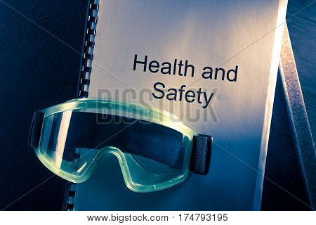 Health And Safety Document With Goggles