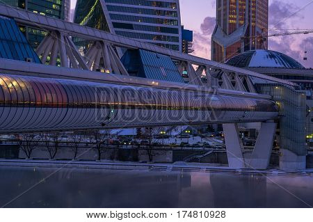 Moscow, Russia - January 25, 2017: Commerce and pedestrian bridge Bagration and the Moscow International Business Center Moscow City in the twilight time of day