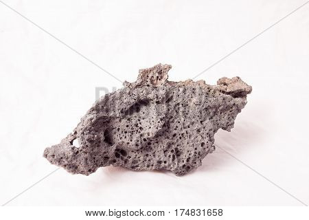 Lava rock piece in the studio on white background.