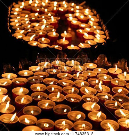Candles Lit With The Warm Flame During The Religious Ceremony