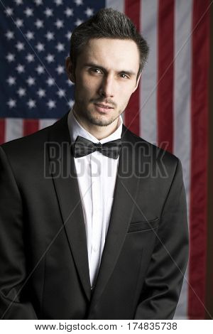Portrait of a young congressman in the background of the American flag