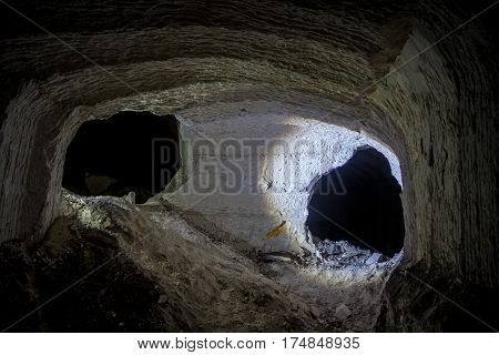 Concept of Alien, Prometheus. Abandoned chalk mine tunnel with fantastic traces of drilling machine, Belgorod, Russia