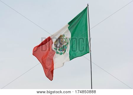 Mexican Flag Weaving On Sky Background