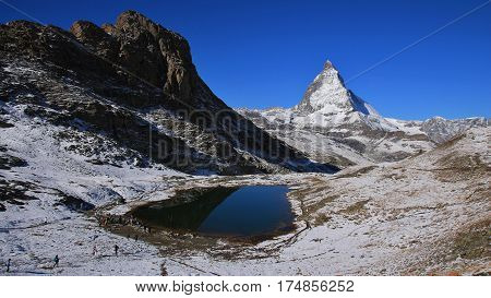 Lake Riffelsee and Matterhorn in autumn. Travel destination in Switzerland.