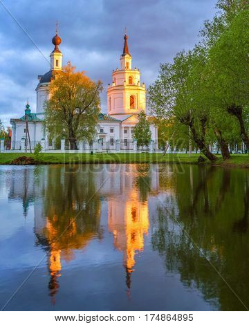 Russian orthodox church and its reflection in a pond. Boldino, Russia
