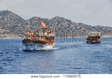 Antalya Turkey - 28 august 2014: Mediterranean Sea off the coast of Antalya a tourist excursion boat underway with passengers.