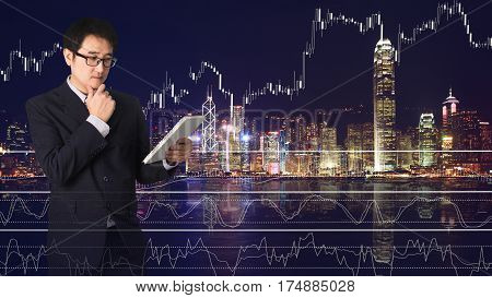 Double Exposure Confident Asian Businessman Reading Notebook Or Document File With Cityscape On Blur