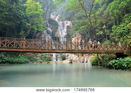 People On Bridge Looking And Take Photo With Viewpoint Of Kuang Si Falls