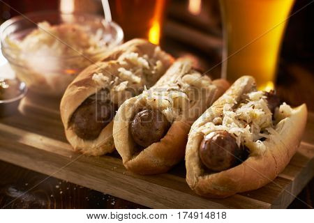 german bratwursts and sauerkraut with beer close up