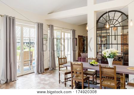 Bright Dinning Area With Large Table