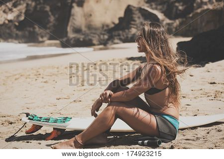 surfergirl is wating for the perfect wave