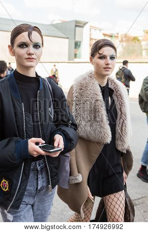MILAN ITALY - FEBRUARY 25: Beautiful models walk outside Antonio Marras fashion show during Milan Women's Fashion Week on FEBRUARY 25 2017 in Milan.