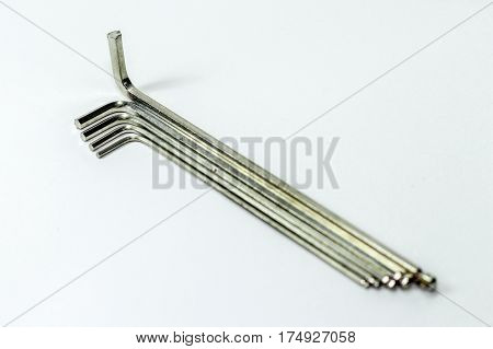 Hex key Set on white background.A hex key, Allen key or Allen wrench is a tool used to drive bolts and screws with hexagonal sockets in their heads.