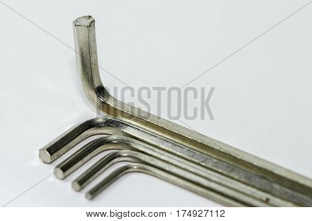 Hex key Set on white background.A hex key, Allen key or Allen wrench is a tool used to drive bolts and screws with hexagonal sockets in their heads.