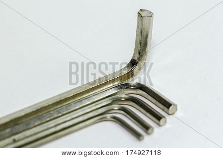 Hex key Set on white background.A hex key, Allen key or Allen wrench is a tool used to drive bolts and screws with hexagonal sockets in their heads.