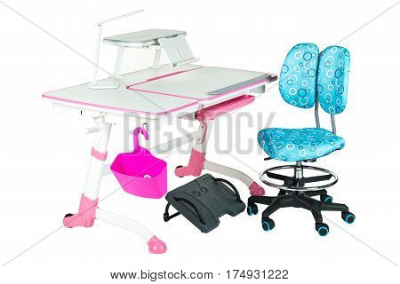 Blue chair pink school table pink basket desk lamp and black support under legs on the white isolated background.