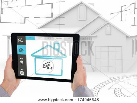 Digital composite image of hand holding a digital tablet with house security concept against digital house model in background