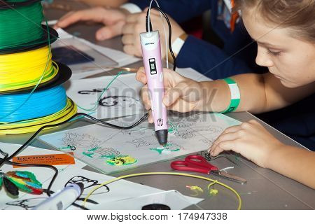 Moscow, Russia - November, 2016: Girl using 3D printing pen