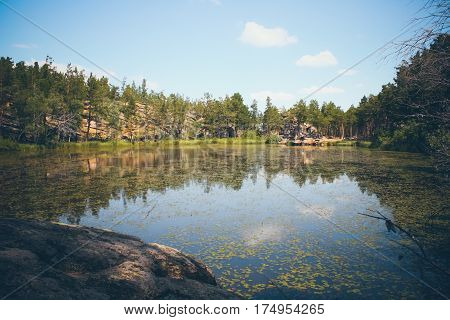 Mountain lake in the background of mountains and blye sky