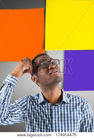 Composite image of thoughtful nud man standing against multicolored sticky note