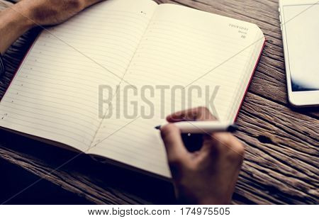 Hand Holding Pen Write Diary Notebook