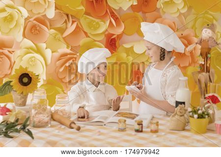 happy little children in the form of chef to prepare delicious