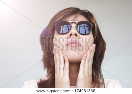 The Girl In Solar Eyes Looking Up, Hands In The Face.