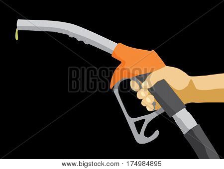 Hand holding fuel nozzle on petrol gas station