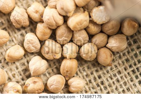 Pile of Dry Organic Uncooked Chickpeas. Healthy Raw Vegan Food Hummus With Chickpeas.