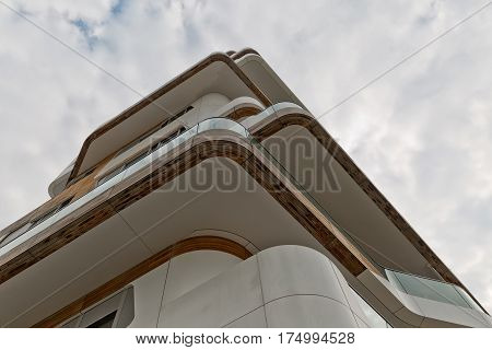 MILAN ITALY-September 2015: Urban Geometry looking up to wooden and white metal cladded corner of new modern residential building houses of City Life business and residential district in Milan. Designed by Zaha Hadid Architects
