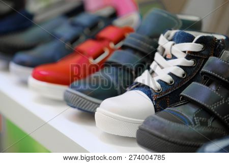 Row of the child shoes in a shop