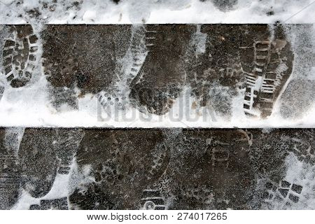 The Problem Of Snow Removal In The City. The Steps Are Icy, Covered With Snow. Footprints In The Sno
