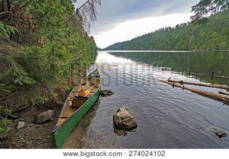 Dramatic Clouds On A Wilderness Portage On This Man Lake In Quetico Provincial Park In Ontario