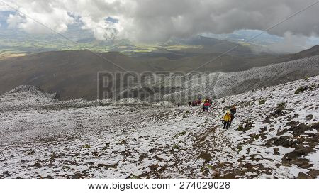 Iliniza, Cotopaxi / Ecuador - October 25 2014: Group Of Climbers Climbing The Sand In The Volcano Il