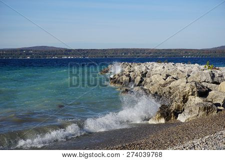 Boulders Serve As A Breakwall To Protect The Bay View Swimming Beach From The Effect Of Waves, In Ba