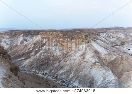 Canyon In The Judean Desert , Midbar Yehuda, On The Dead Sea, Israel. Background Of Lifeless Land In
