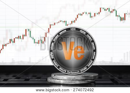 Veritaseum (veri) Cryptocurrency; Veritaseum Coin On The Background Of The Chart