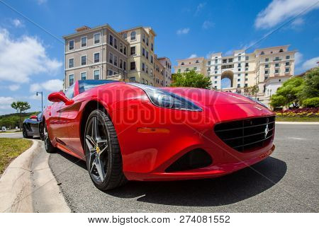 San Antonio, Tx - April 2, 2018 - Low Angle Close Up View Of Red Ferrari F12 Parked Ousite On A Brig