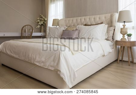 Closeup Of New Bed Comfort With Decorative Pillows Headboard In Bedroom In Staging Model Home