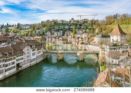 Bern, Switzerland. View Of The Old City Center And Nydeggbrucke Bridge Over River Aare.