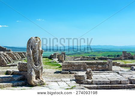Headless Statue In The Ancient Roman City Of Dougga In Tunisia