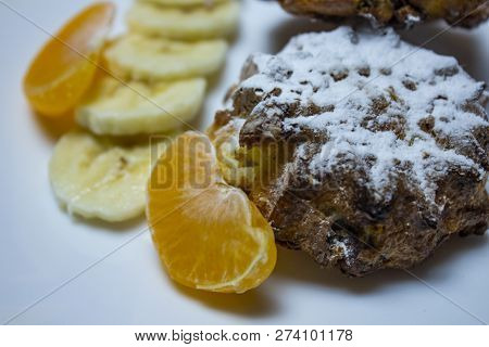 Cup Cakes With Raspberries And Nuts On A White Wooden Background. Tangerine Slice