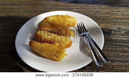 Four Fried Banana Dessert, For Two On Wooden Table. Indonesian Style.