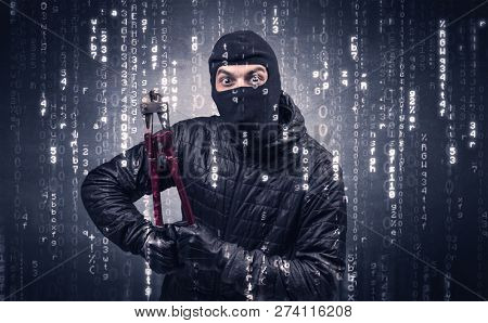 Burglar in action with encoded concept and his tools in his hand. 