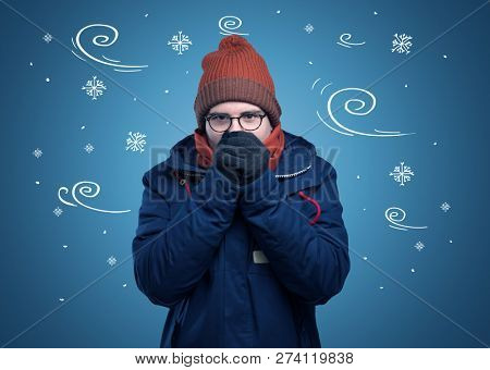 Young hipster frozen boy with doodled snowflakes and windy concept