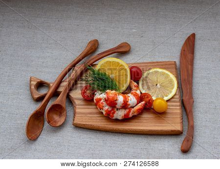 Surimi With Lemon, Tomato And Dill On A Wooden Board Close-up.
